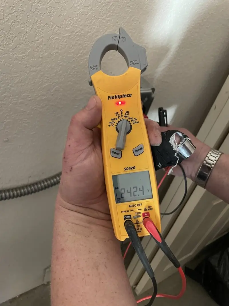Voltage testing with clamp meter during Electrical Installation Services in East Providence